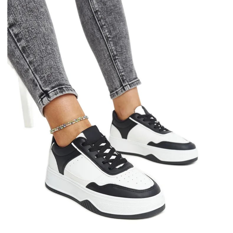 White and black sneakers with a thick Rumai sole