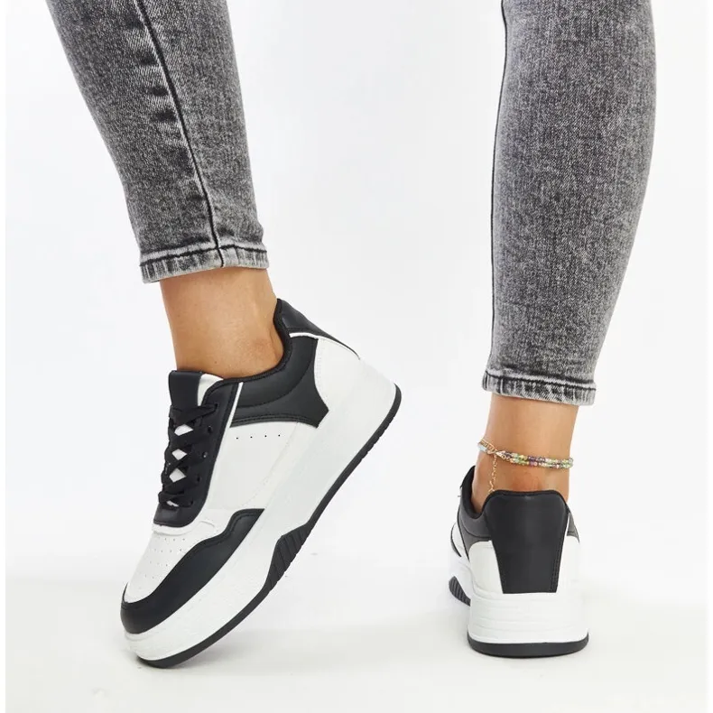 White and black sneakers with a thick Rumai sole